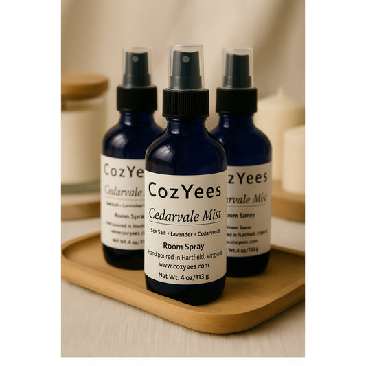 Three CozYees Cedarvale Mist room spray bottles on a wooden tray.