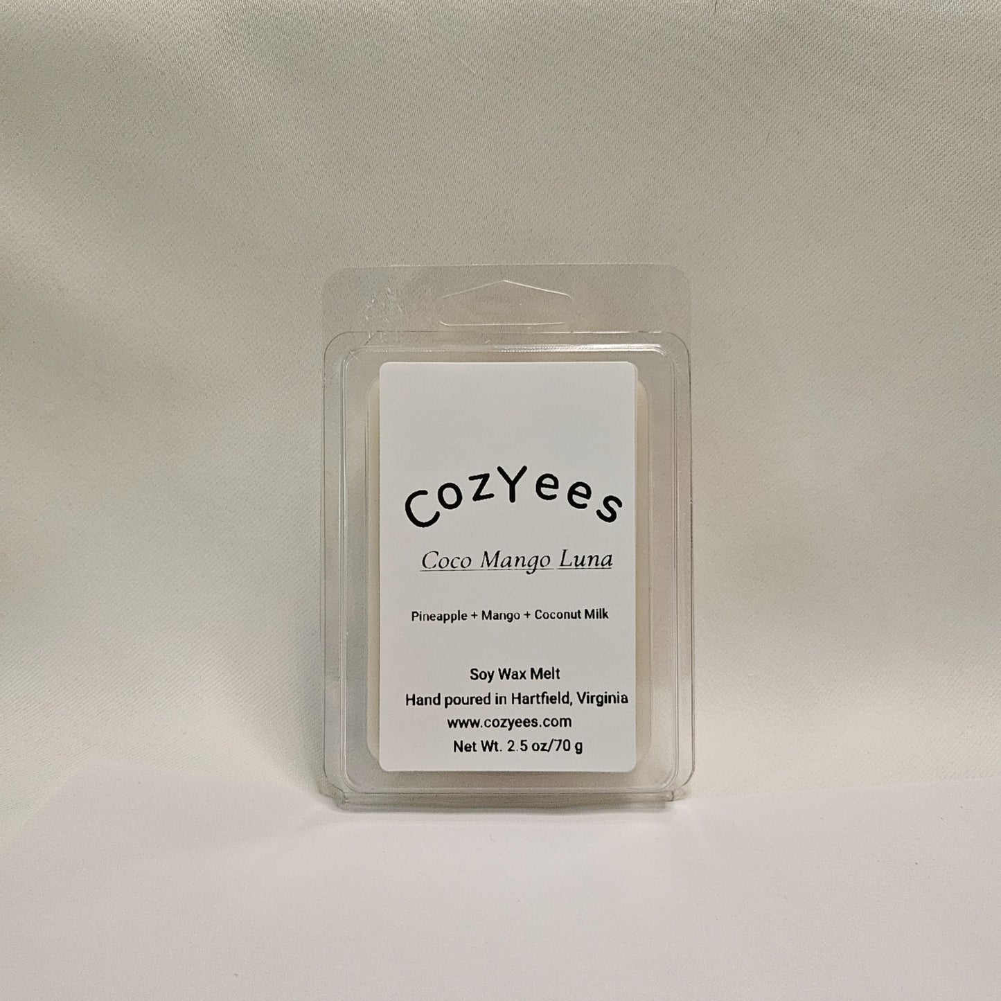 Cozyees Coco Mango Luna wax melt packaging on a beige background