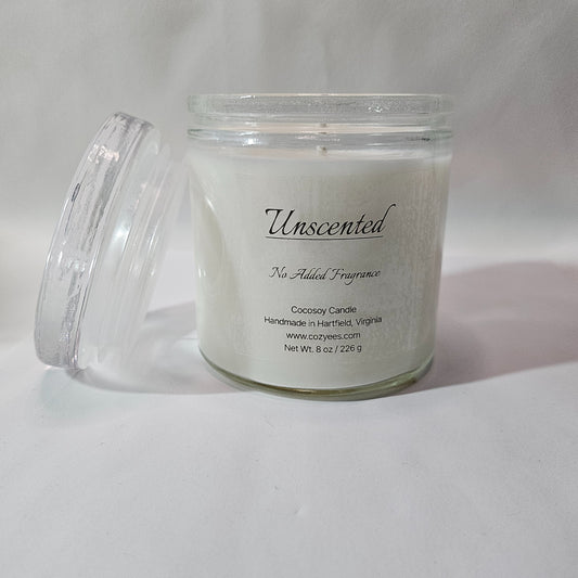Unscented candle in a glass jar with a lid on a white background