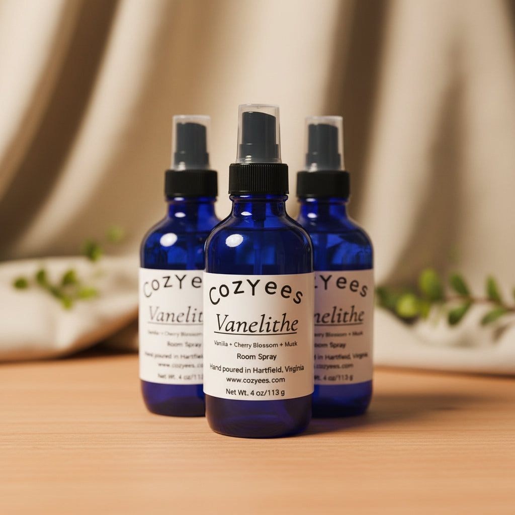 Three blue spray bottles labeled 'Cozyees Vanelithe' on a white background.