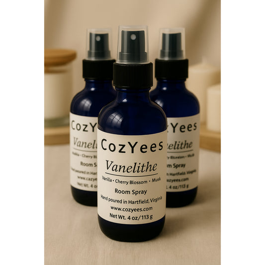 Three CozYees Vanelithe room spray bottles on a neutral background