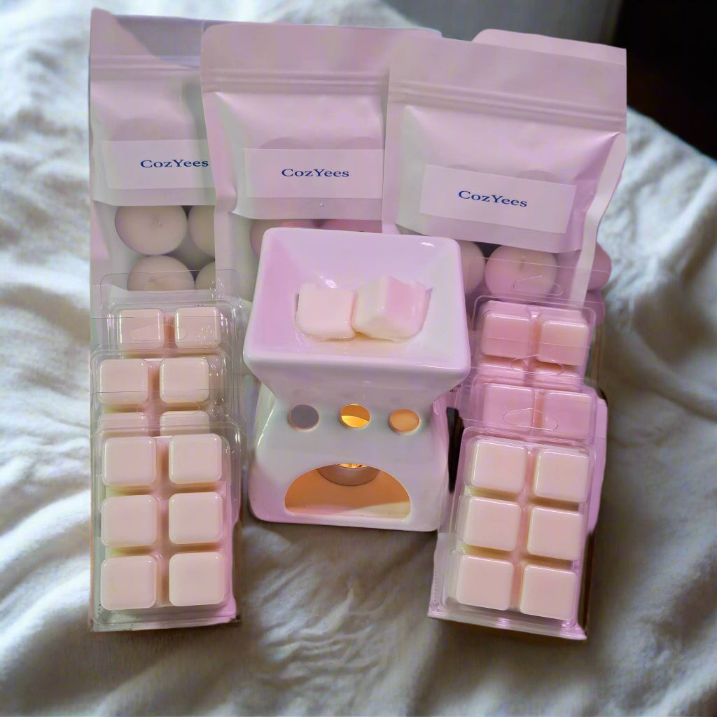 Set of CozYees wax melts and warmer on a neutral background