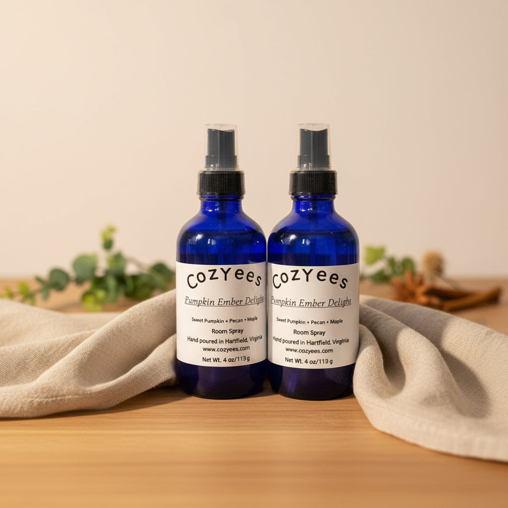 Two blue bottles with white labels on a gray textured background