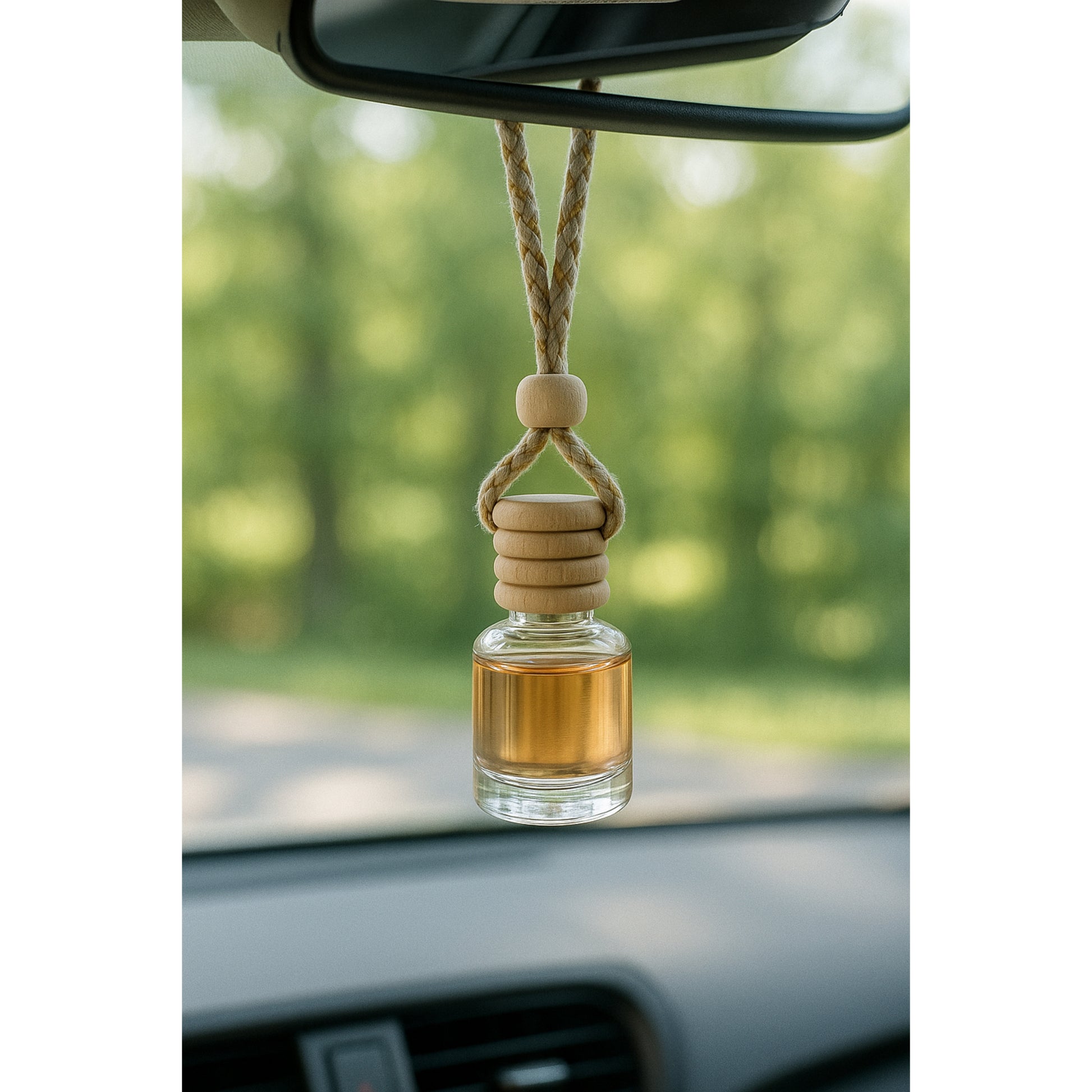 Cozyees car diffuser hanging fron the rearview mirror.