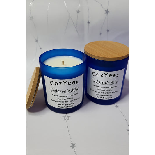 CozyYees Cedarvale Mist candle with blue container and wooden lid on a white background