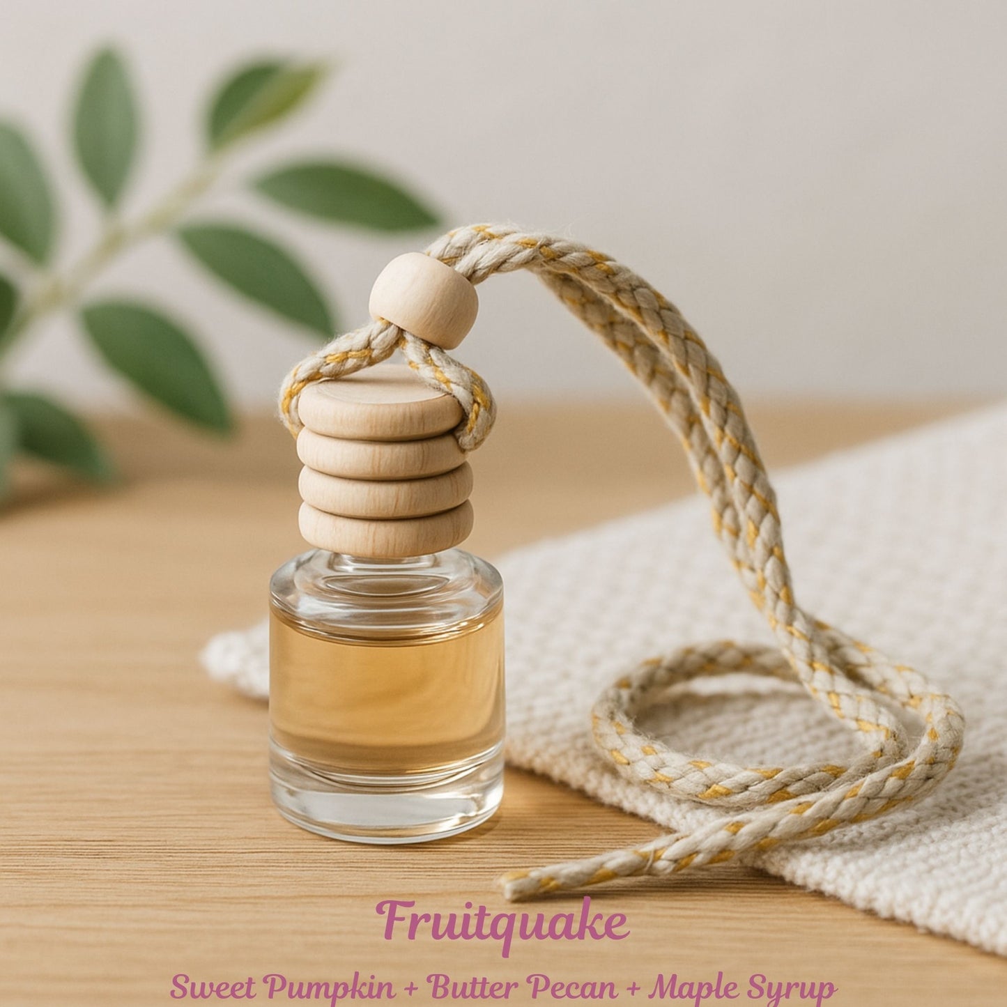 Cozyees glass diffuser on table with fruit scent text