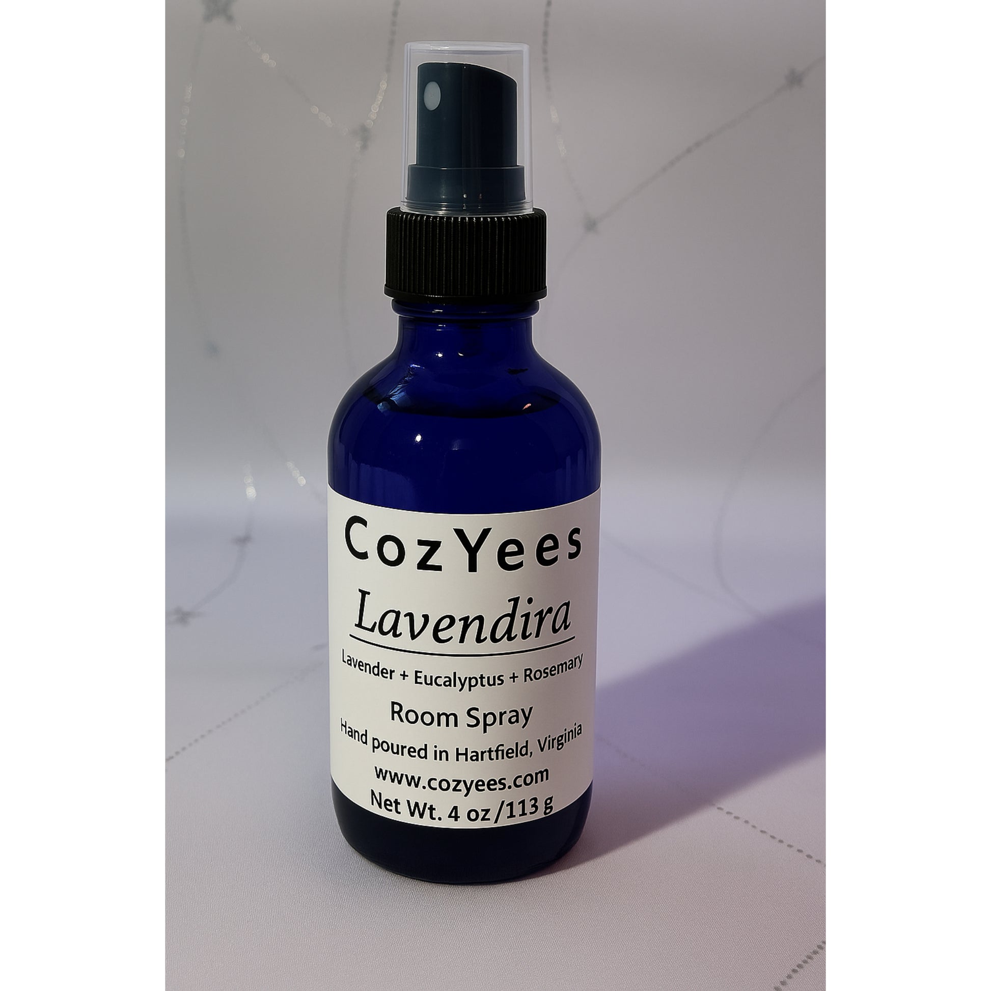 Cozyees Lavendira room spray bottle on a light gray background