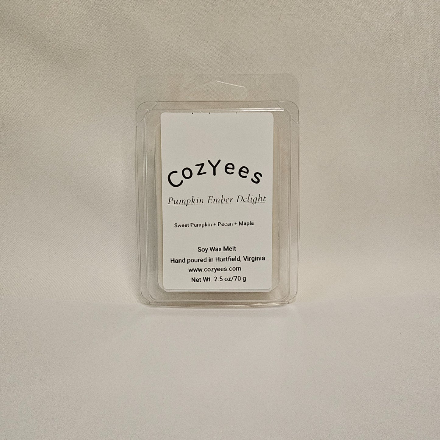 Cozyees pumpkin timber delight wax melt packaging on a beige background