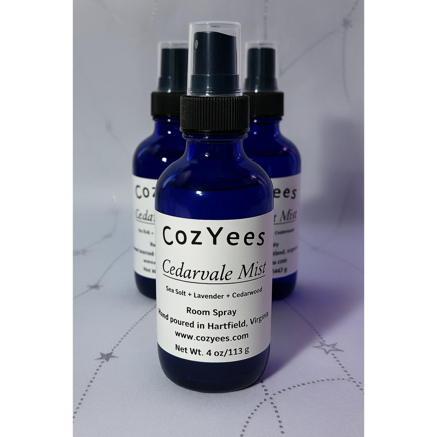 CozYees Cedarvale Mist room spray bottles on a white background