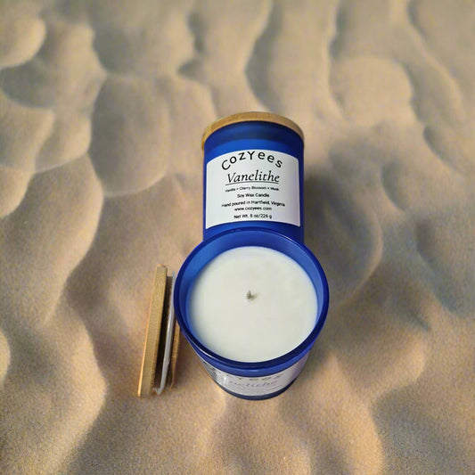 Cozyee's Vanillee candle with blue container on a white background
