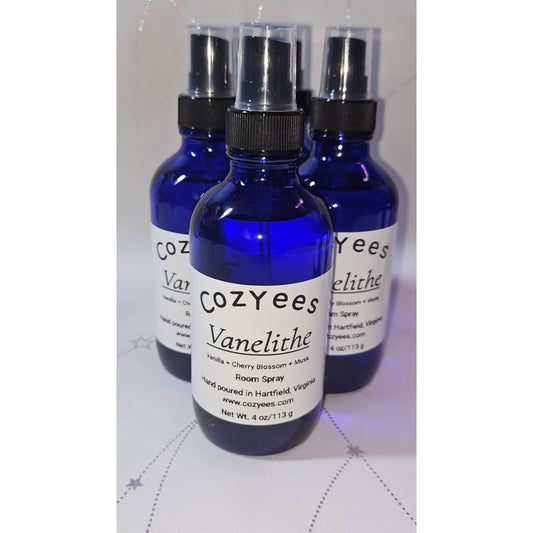 Three blue spray bottles labeled 'Cozyees Vanelithe' on a white background.