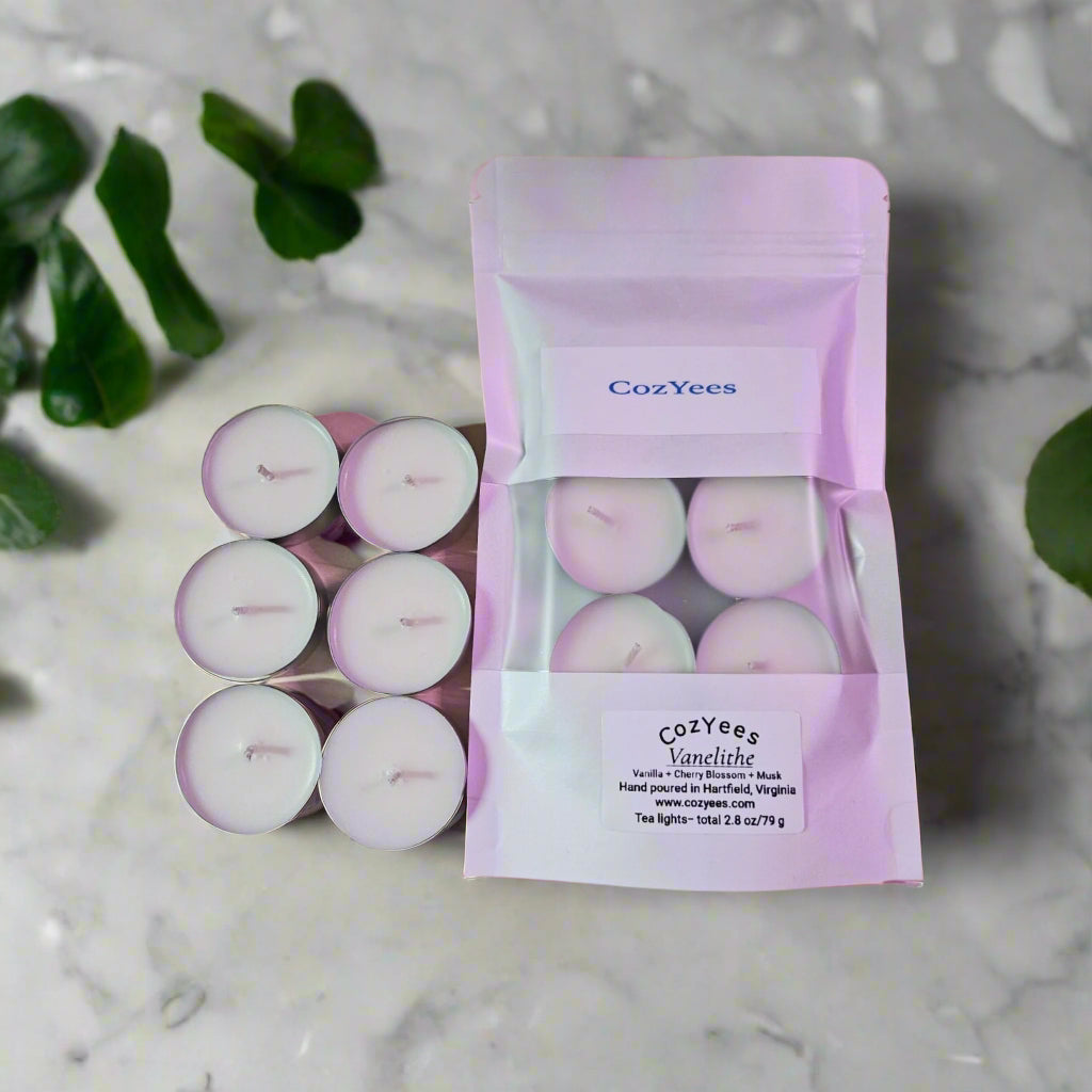 Cozyees tealight candles with packaging on a whitesurface