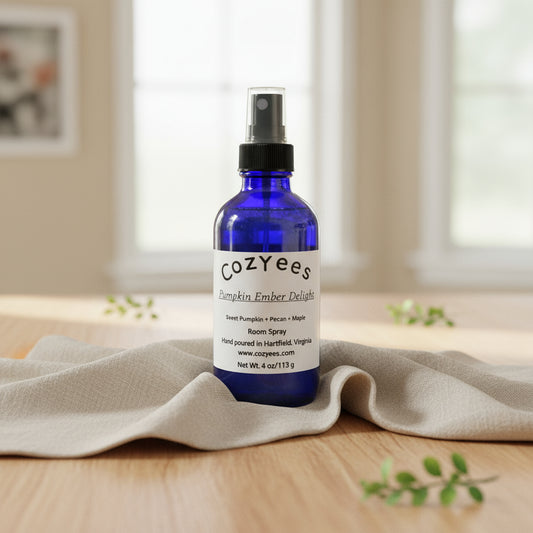 Blue Cozyees bottle on a textured white background