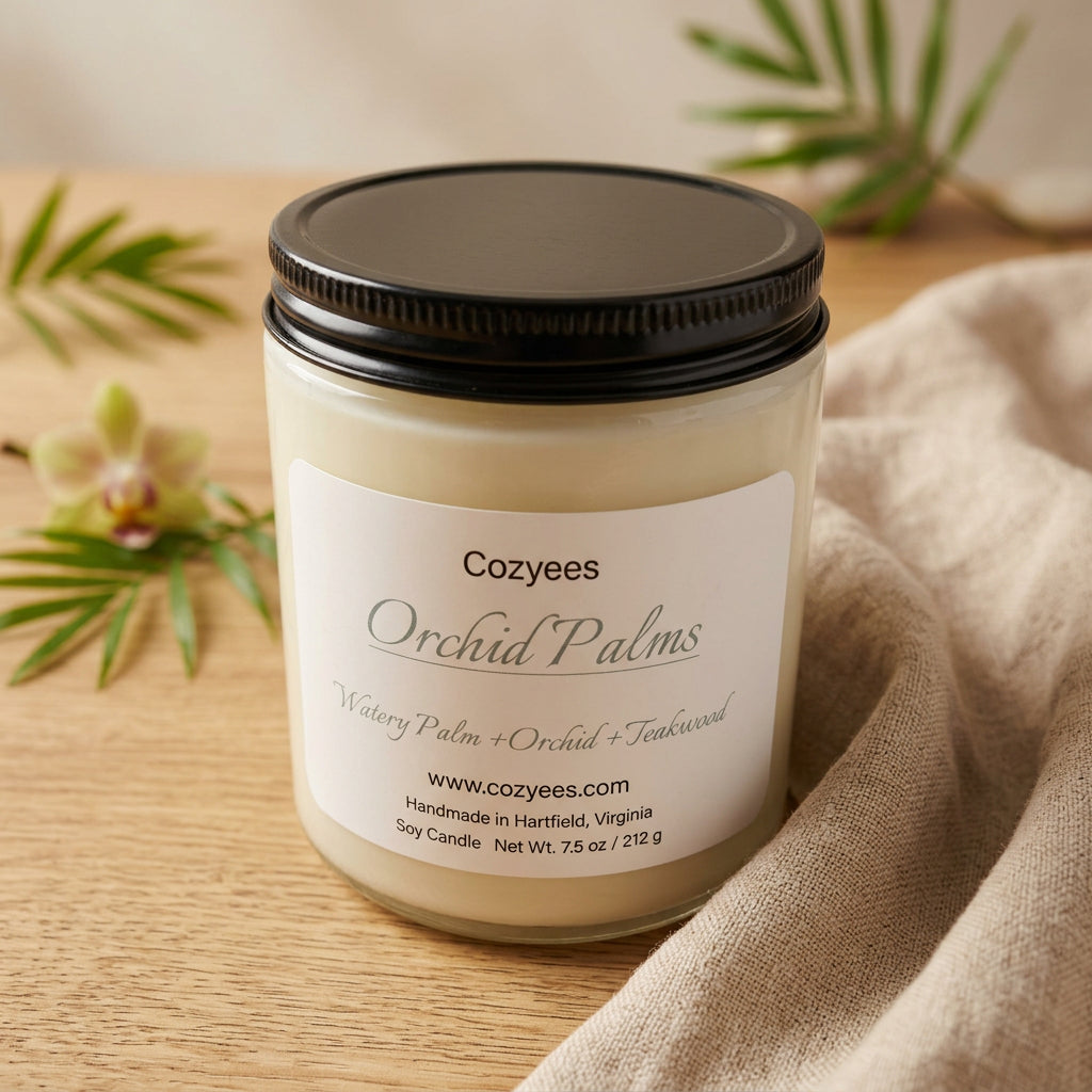 Cozyees Orchid Palms 7.5 oz soy candle in a clear glass jar with a black lid
